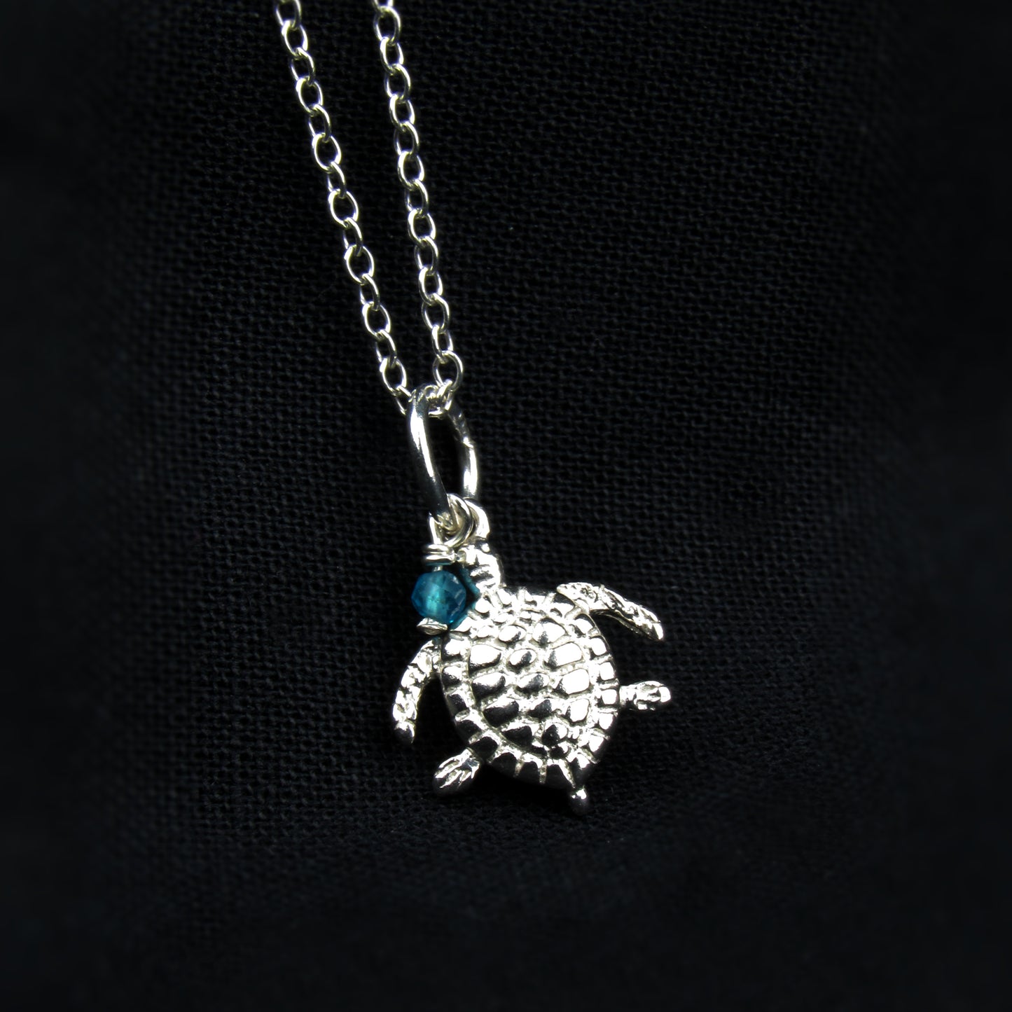 sterling silver turtle pendant with blue gemstone