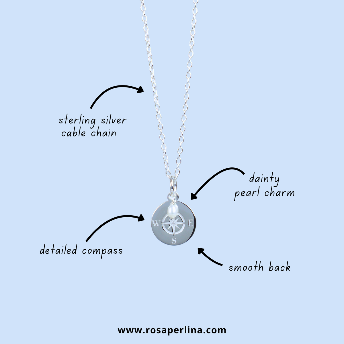 Silver cable chain necklace with a round compass pendant and a dainty pearl charm, shown on a light blue background with callout labels pointing to the sterling silver cable chain, dainty pearl charm, detailed compass, and smooth back.