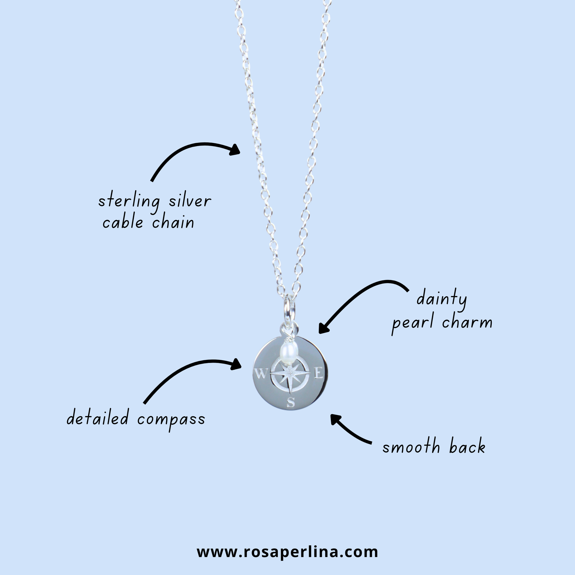 Silver cable chain necklace with a round compass pendant and a dainty pearl charm, shown on a light blue background with callout labels pointing to the sterling silver cable chain, dainty pearl charm, detailed compass, and smooth back.