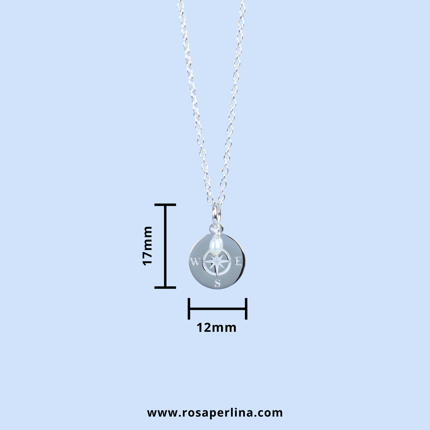 Silver compass pendant necklace on a delicate chain, shown with dimension lines indicating a height of 17mm and width of 12mm, on a light blue background.