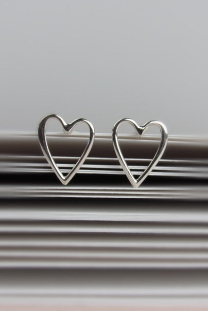 Two silver heart-shaped earrings 