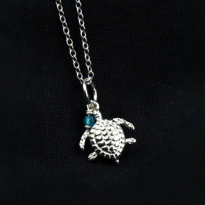 sterling silver turtle pendant with blue gemstone
